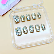 zb65..A display board featuring 24 different styles of fashionable and trendy nail art.