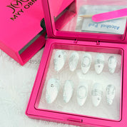 zb34..A collection of almond-shaped and square-shaped wearable nails